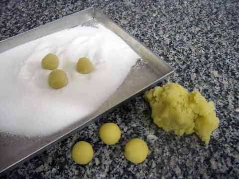 rolling the almond ball in sugar