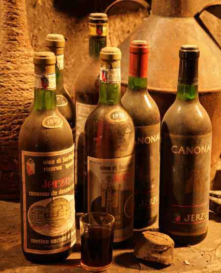 a collection of old cannonauwine bottles of wine