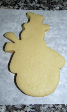 raw christmas snowman cut out cookie