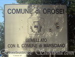 welcome sign post of the town of orosei in sardinia