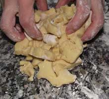 collecting the left over cuttinf of the biscuit dough