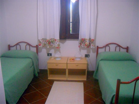 bedroom with two single besd in the villa apartment