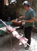 preparing the meat on the skewer