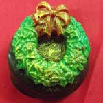 almond sandwich cookie with chocolate wreath decoration