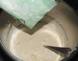 adding the flour to the whisked eggs