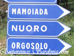 road sign indicating the ciyt of nuoro in sardinia