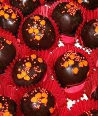 orange flavored almond ball coated in dark chocolate