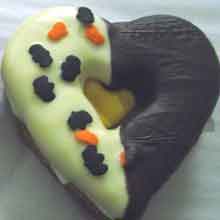 heart shaped almond cookie filled with orange cream