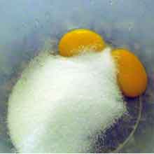 egg yolks and sugar in a bowl