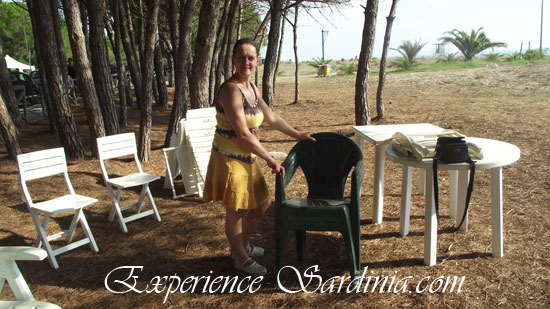 setting up the picnic camp on the beach of museddu in sardinia italy