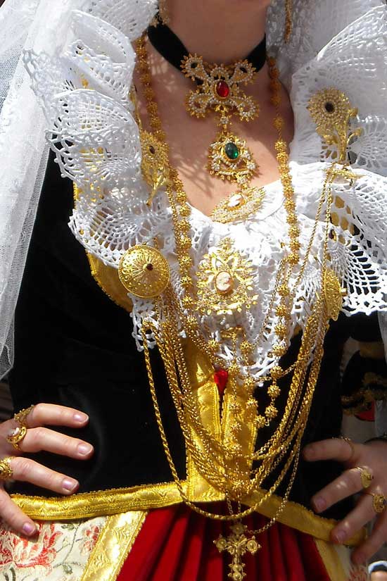 sardinian lady dressed in national costume showing of the gold filigree jewellery