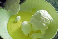 adding whisked egg whites to tiramisu cream