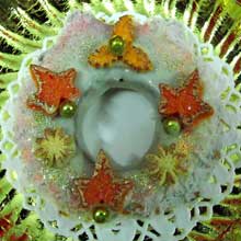 white chocolate wreath cookie with orange decorations