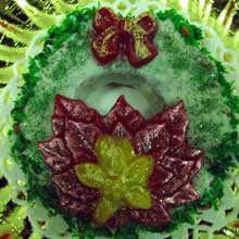 wreath cookie with a red poisettias chocolate flower