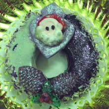 purple wreath cookie with santas face